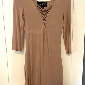 Small tan dress with scrappy front detail.